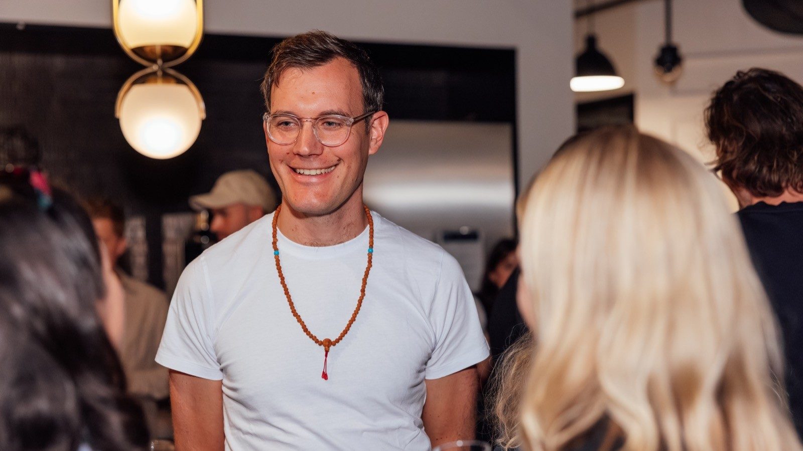 Jonatan Littke chatting with people at a networking event